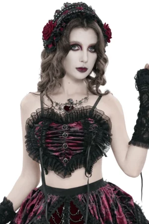 Black mesh gothic heart bustier crop top with burgundy velvet front panel, ruffled tulle trim, and decorative lace-up side detail on fashion model, front studio view