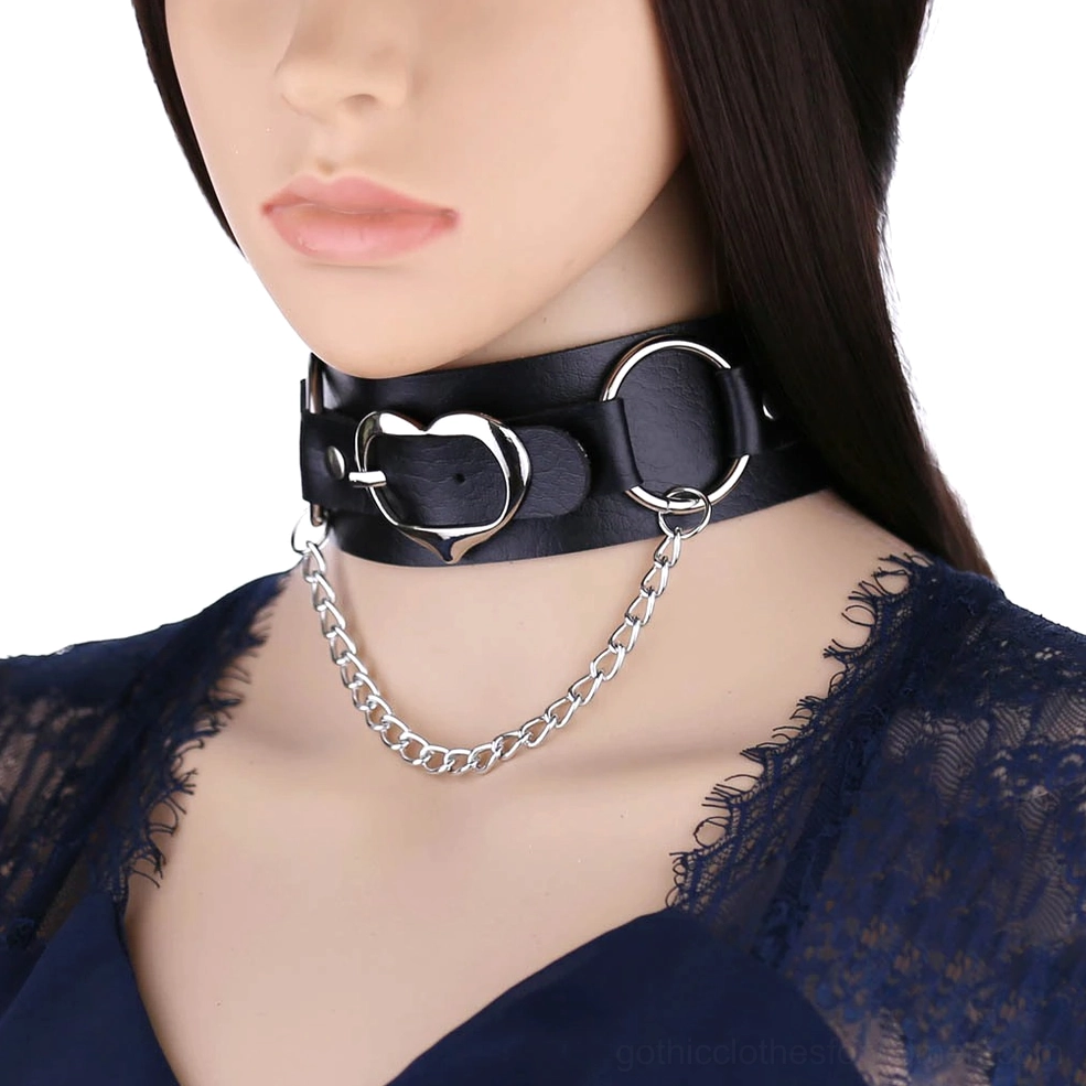 Black PU leather gothic choker with silver heart pendant and chain displayed on female mannequin, front close-up view