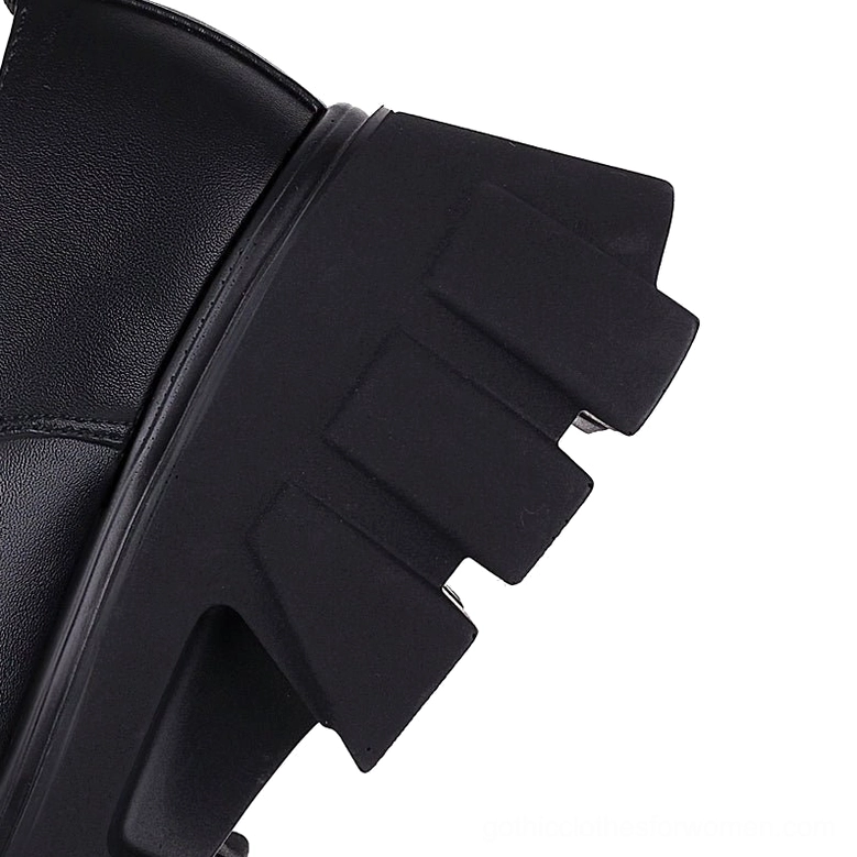 Bottom view of gothic platform pump showing thick black rubber lug sole with aggressive jagged tread design for grip and stability