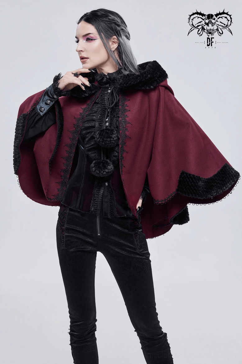 Red gothic cape worn styled display with black fur trimmed hood and pom-pom decoration