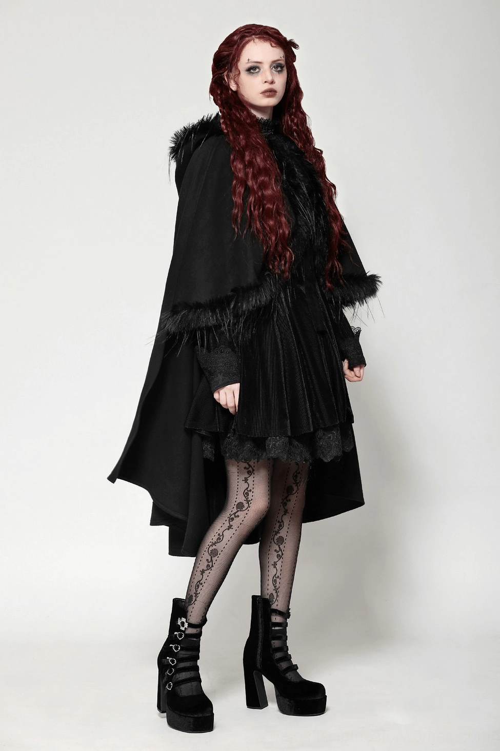 Black gothic hooded cape with luxe faux fur trim styled with dark accessories and hosiery