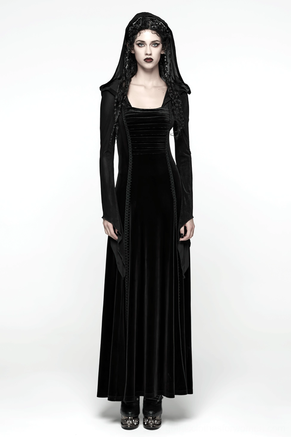 Alternative angle of black gothic velvet hooded dress displaying architectural pleating, dramatic hood, and luxurious fabric texture