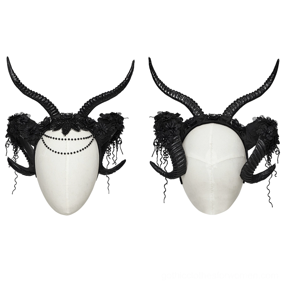 Gothic horned headpiece on white display dummy, frontal view showing beaded forehead chain and lace floral details