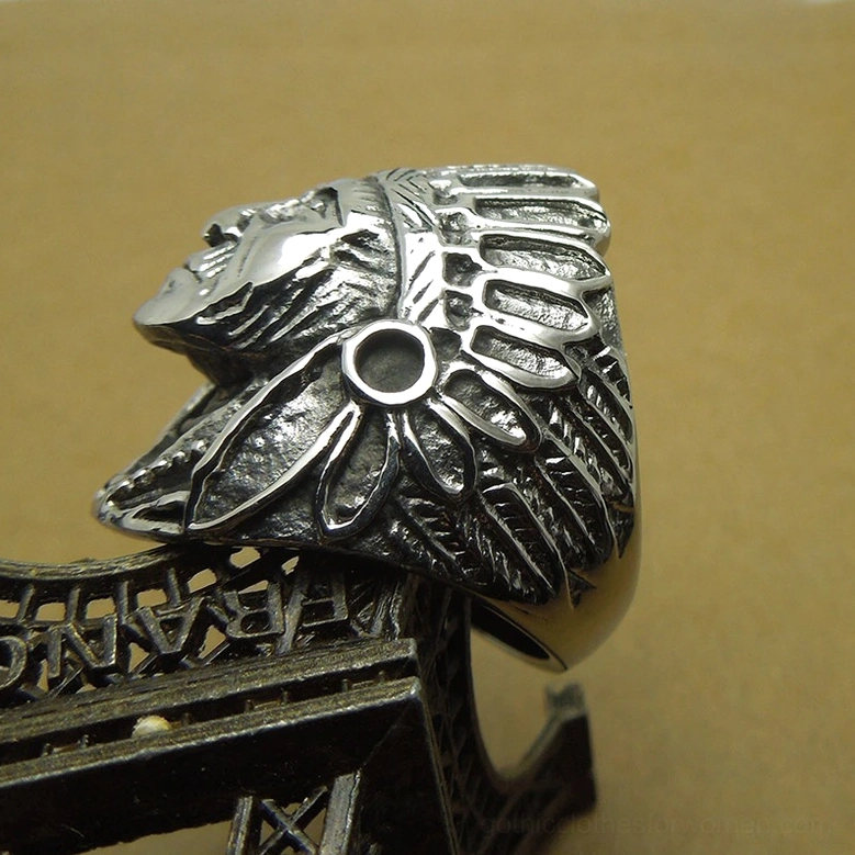 Left tilted angle view of gothic Indian chief statement ring emphasizing curved band design and side feathered details