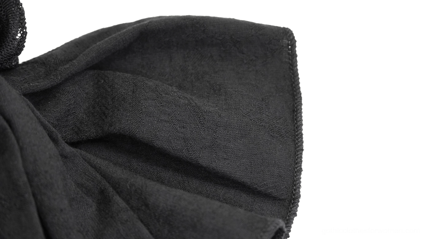 Alternative angle of black gothic lace jabot tie showing overall construction and dimensional ruffle layers