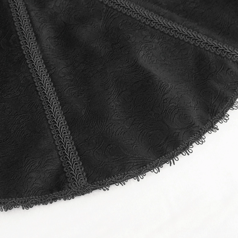 Close-up detail of jacket fabric showing floral jacquard texture, embroidered lace trim, and frayed raw edge finish