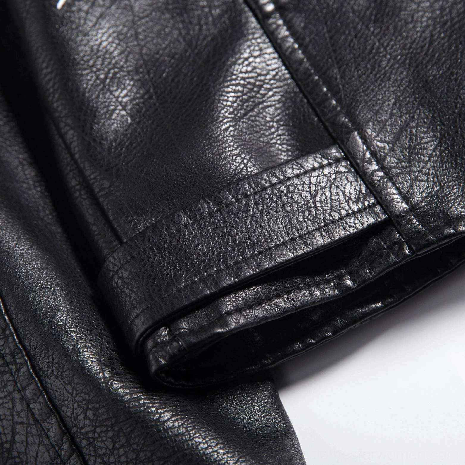 Black faux leather motorcycle jacket hanging display with overall fit proportions and silhouette showcase