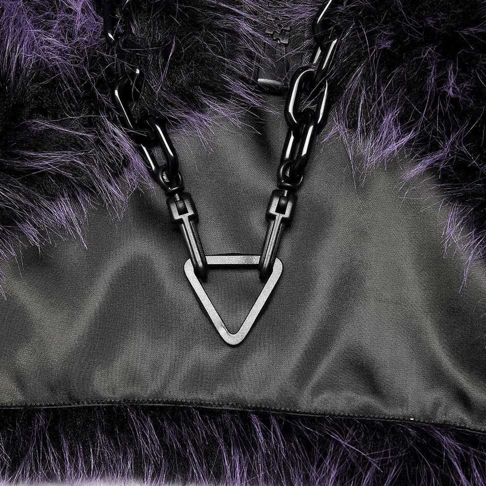 Chain ornament detail close-up showing chunky black metal chain with geometric triangle pendant