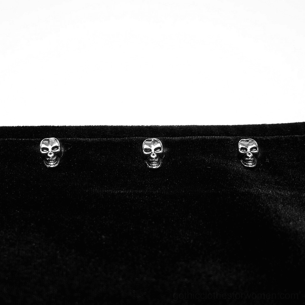 Close-up of skull studs metal hardware on velvet hood trim - gothic jacket decorative detail