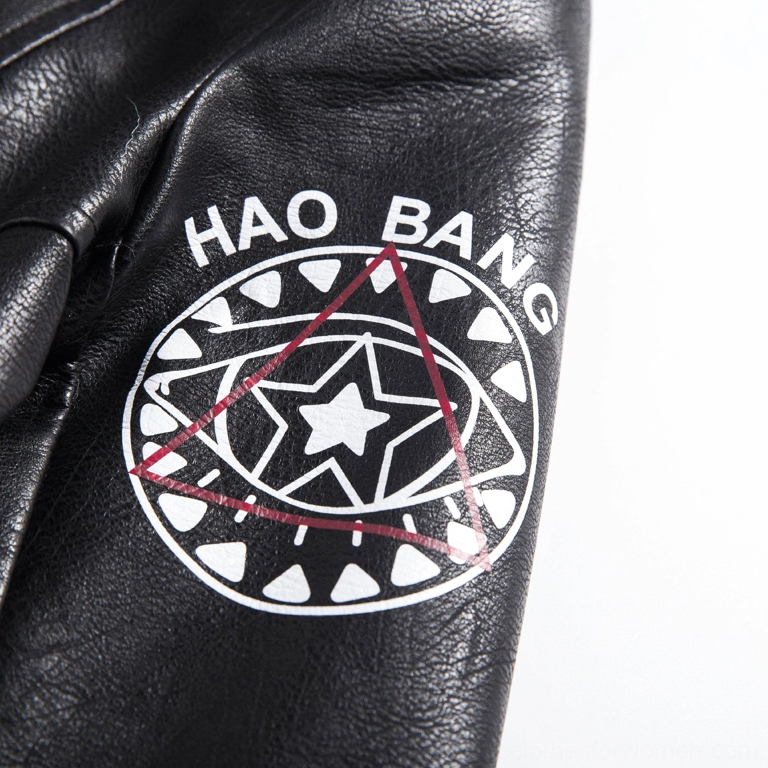 Black PU leather jacket showing stud rivet placement and 3D print texture detail on motorcycle jacket style