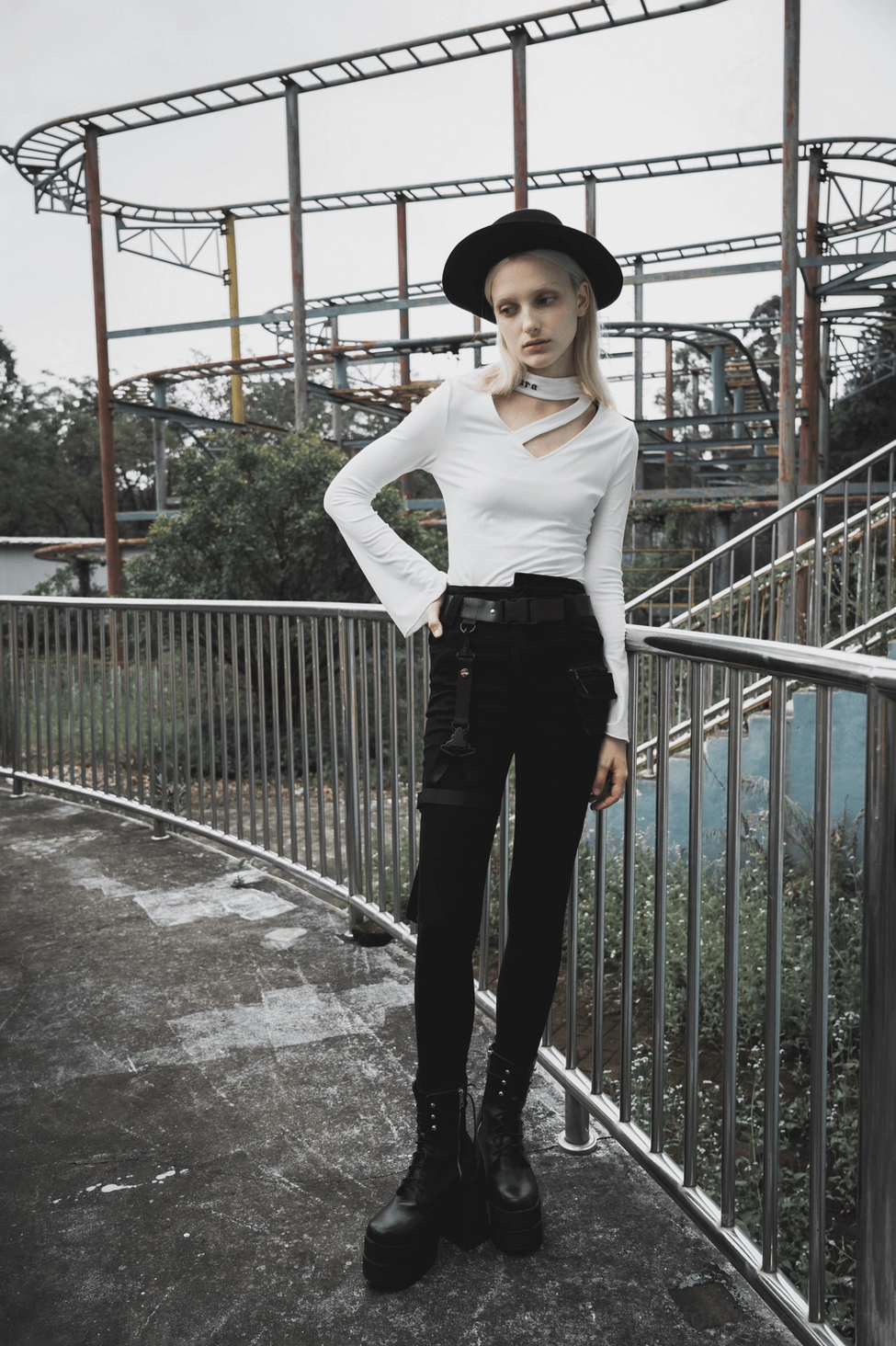 Black gothic denim jeans product shot emphasizing detachable belt and waistband construction