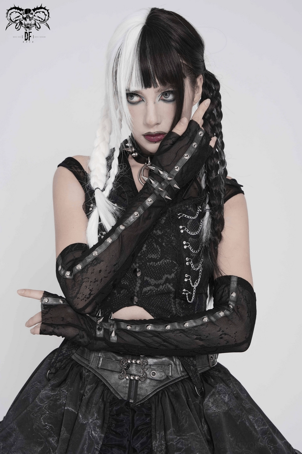 Flat lay shot of gothic lace arm sleeves pair with spike stud cuffs showing complete product dimensions and design