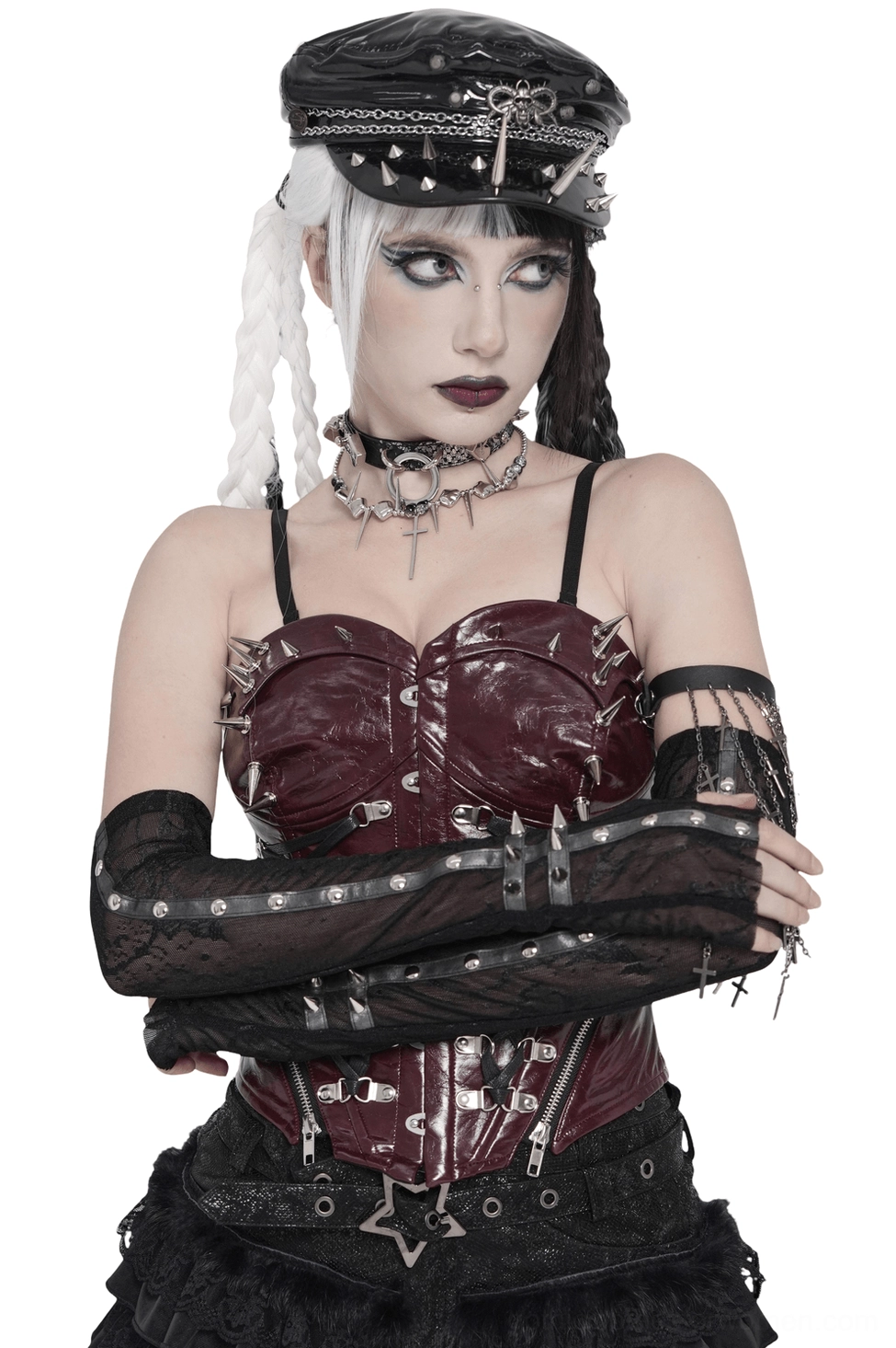 Gothic lace fingerless arm sleeves with spike stud cuffs worn on model with braided hair, front three-quarter view showing sheer black mesh pattern and studded details