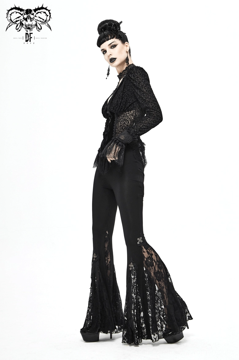 Back full-body view of black gothic cross lace bell-bottom leggings on model displaying dramatic flared hem with lace embellishments