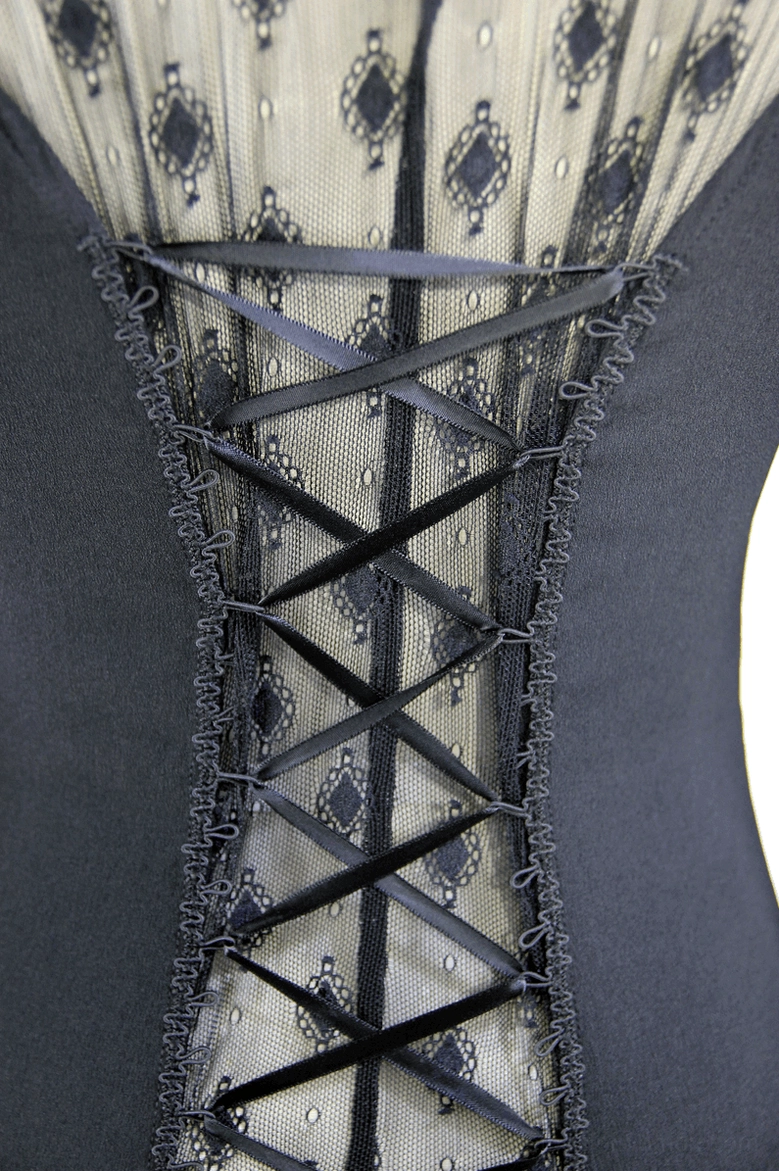 Close-up of gothic blouse back lace-up detail showing crisscross ribbon corset closure and dotted mesh panel