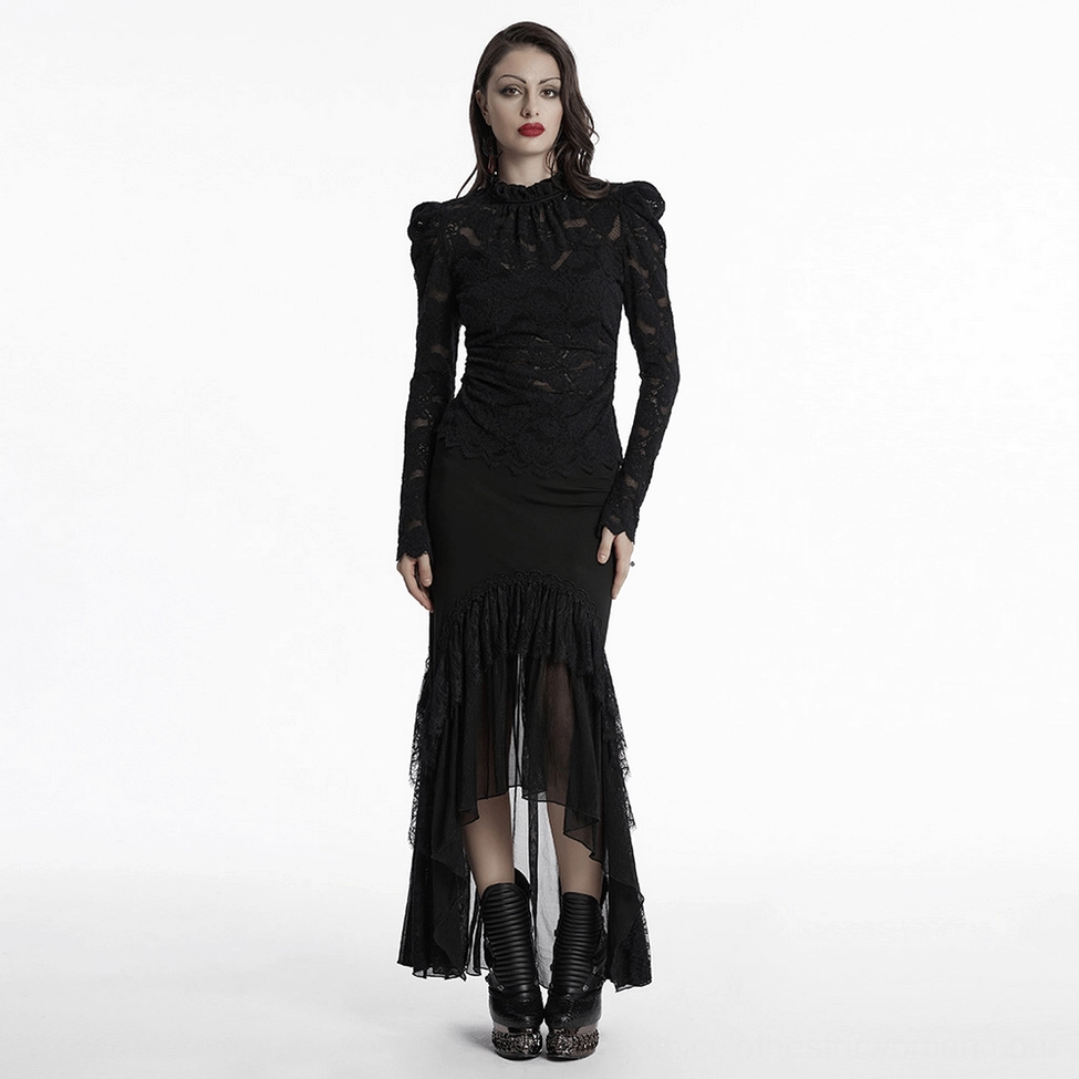 Black gothic lace blouse lifestyle view on model in studio showing elegant drape of sheer floral lace fabric and romantic aesthetic