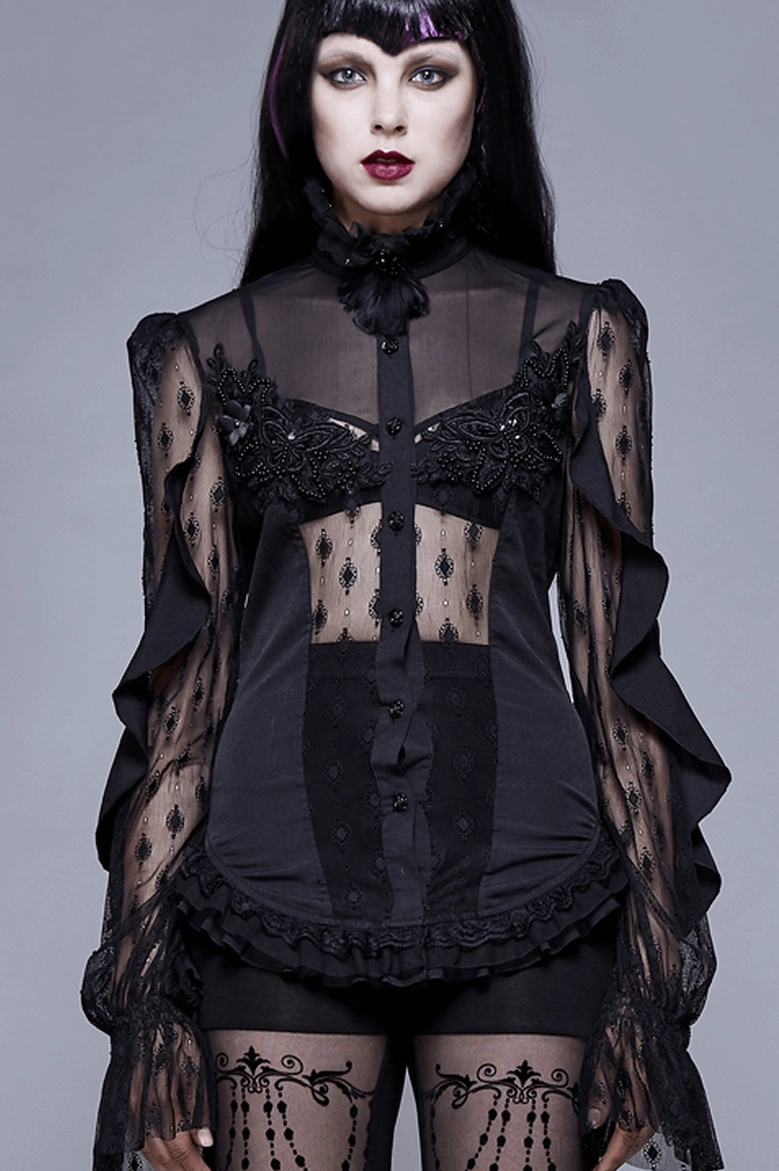 Black gothic lace blouse on model showing sheer sleeves, see-through front panel, and intricate embroidered bodice details