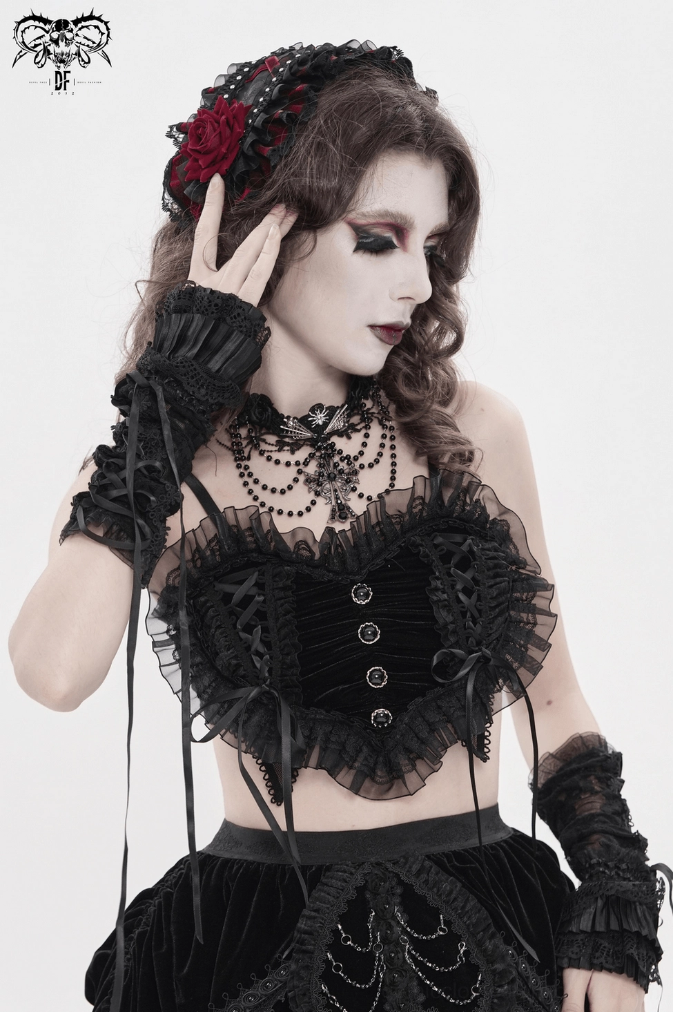 Gothic lace bralette detail shot revealing metal button placement, lace construction, and fashion forward styling