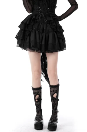 Black gothic lace mini skirt with corset lace-up waist belt detail and lace socks, front view on model