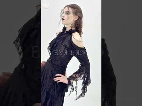 Dark gothic lace dress with cold-shoulder silhouette and flared sleeves, side angle styling view