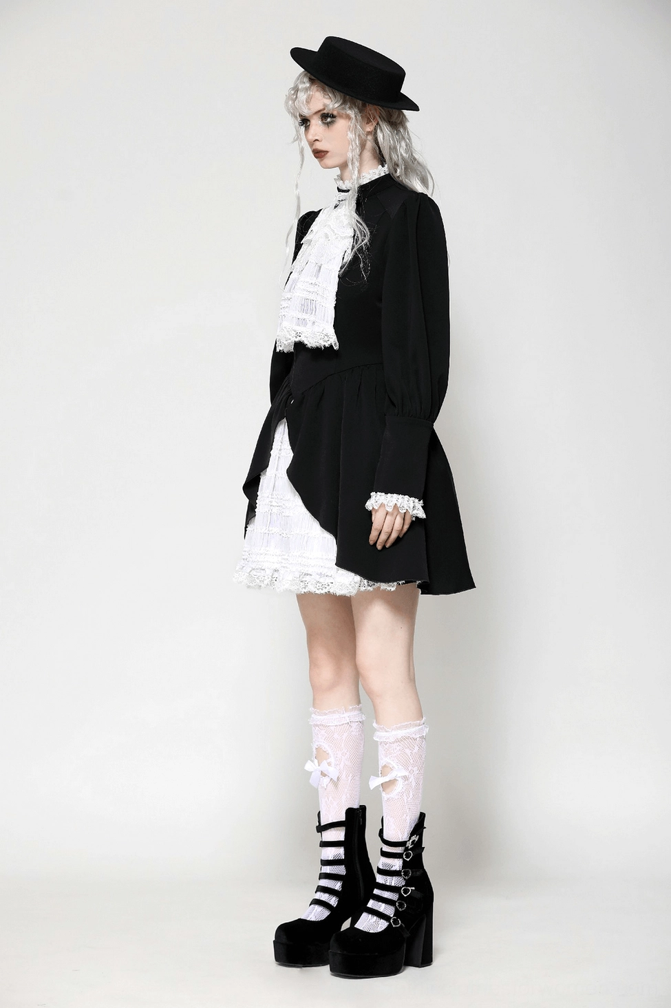 Detailed view of gothic lolita dress construction - layered lace elements, ruffled tiers, and Victorian-inspired design elements