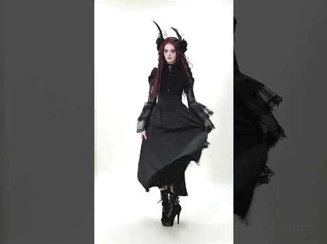 Dynamic walking shot of black gothic lace maxi dress showing full-length silhouette with flowing floor-length skirt and bell-sleeve movement