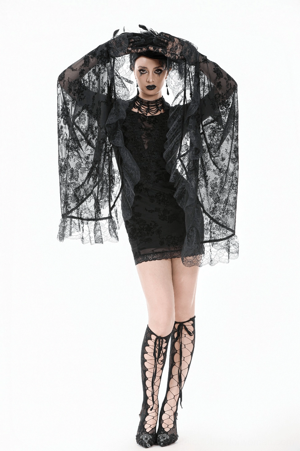 Black lace gothic mini dress showing bell sleeve drape and overall silhouette