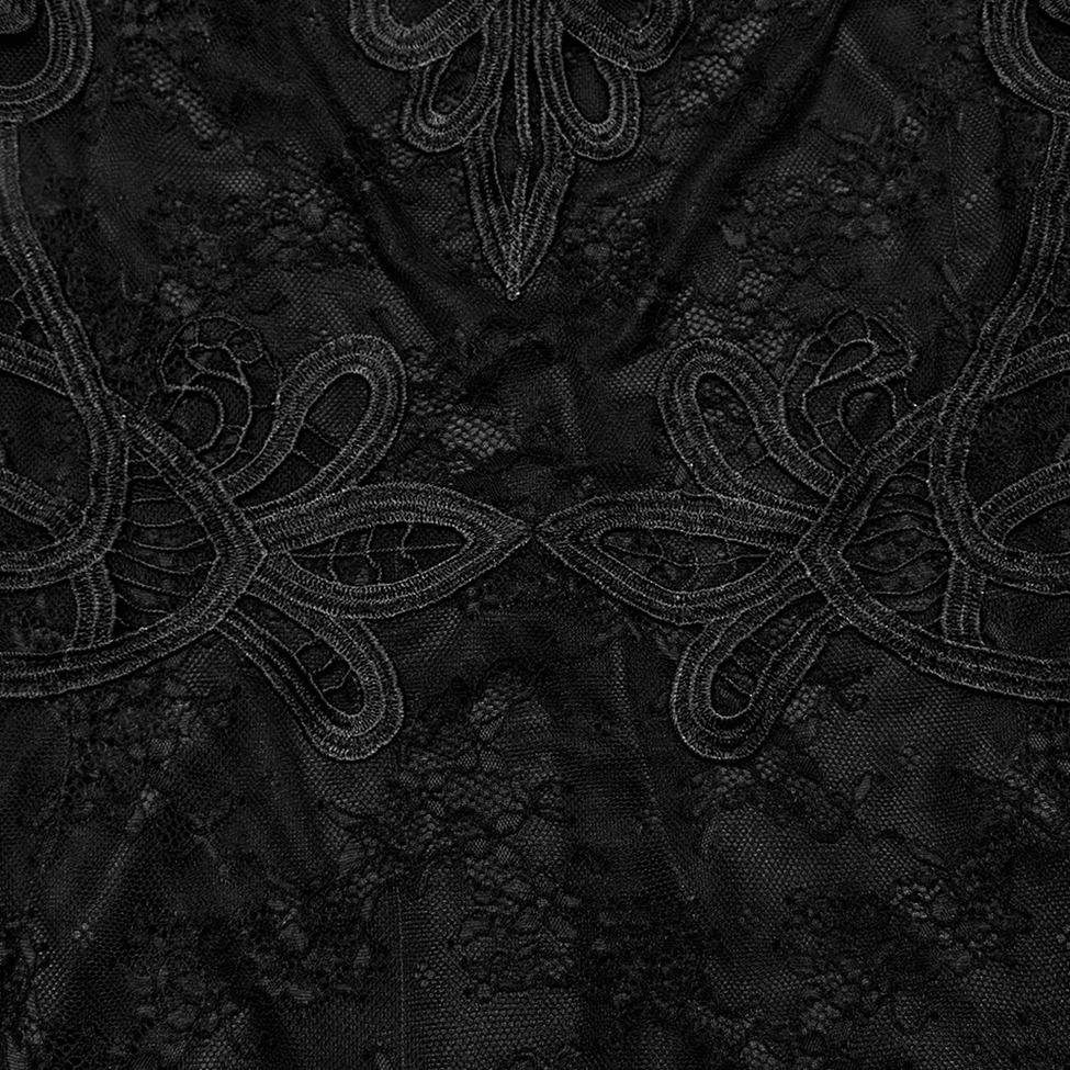 Close-up detail of intricate scroll and floral lace pattern on gothic dress