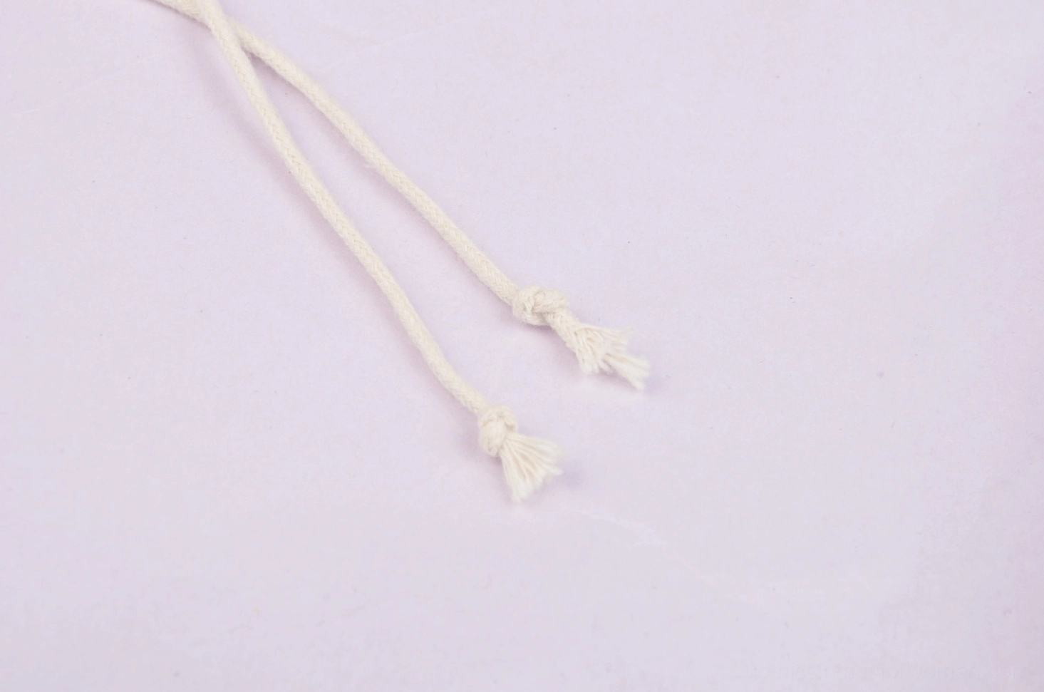 Detail photograph of gothic lace dress showing layering construction and delicate cream-on-cream lace complexity