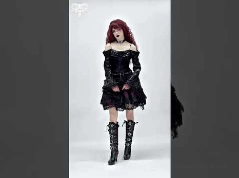 Model wearing Victorian gothic off-shoulder lace dress set with red curly hair, paired with punk boots and choker necklace