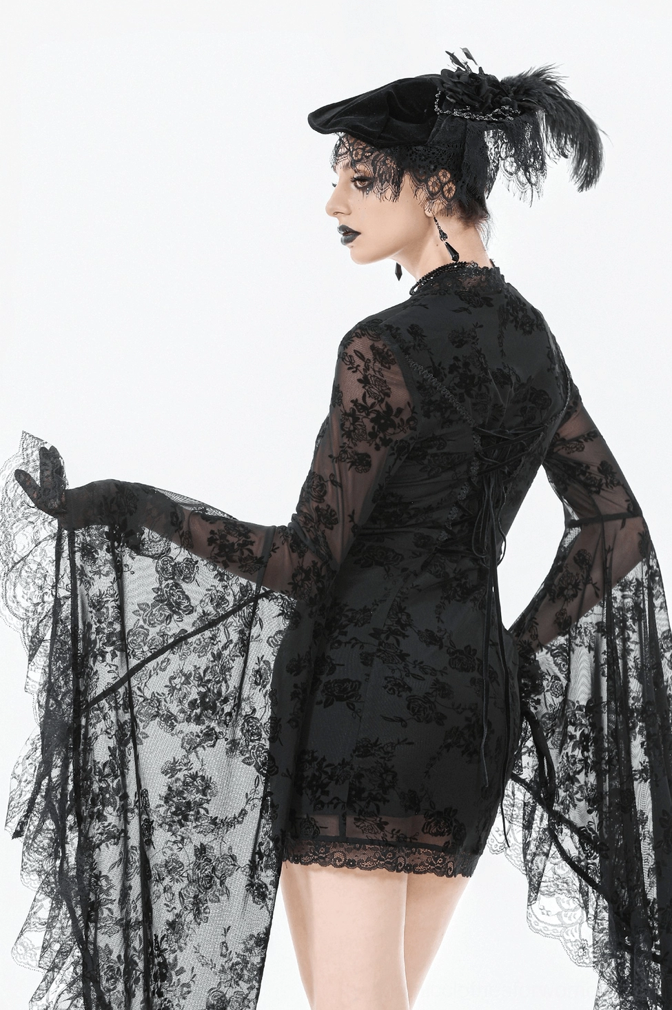 Black lace gothic dress side detail showing slim fit and bell sleeve length