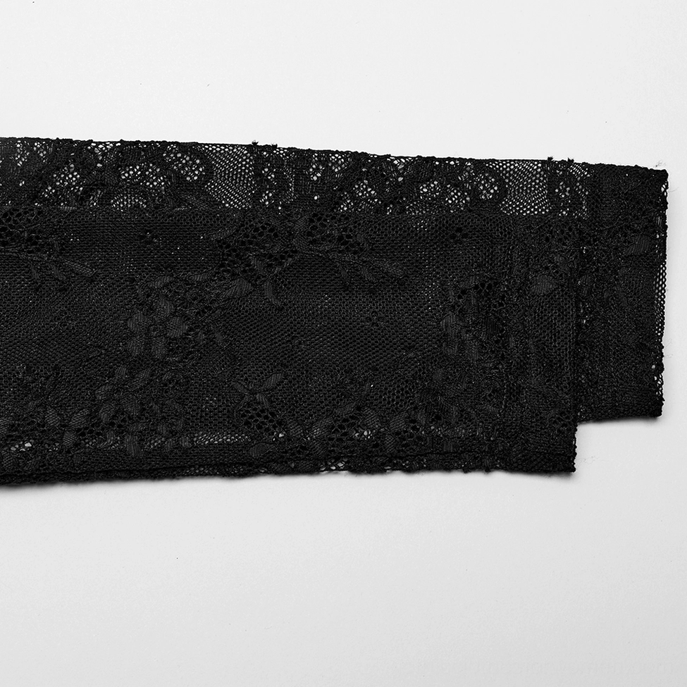 Detailed view of sheer black lace sleeve fabric with fine floral texture