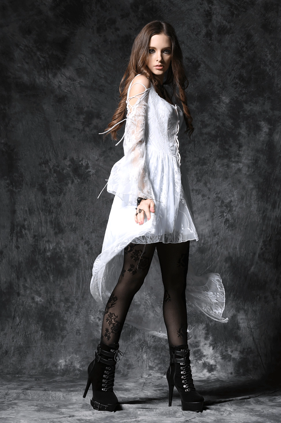 Gothic lace dress with sleeve lace-up ties and platform combat boots styling