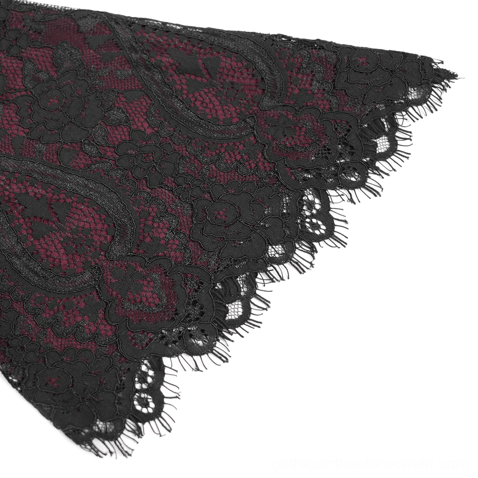 Close-up macro shot of black floral lace fabric texture with wine red mesh base and delicate eyelash lace trim edge