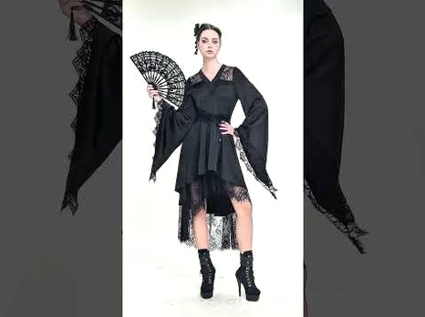 Black gothic bell sleeve lace midi dress on model with vintage fan accessory