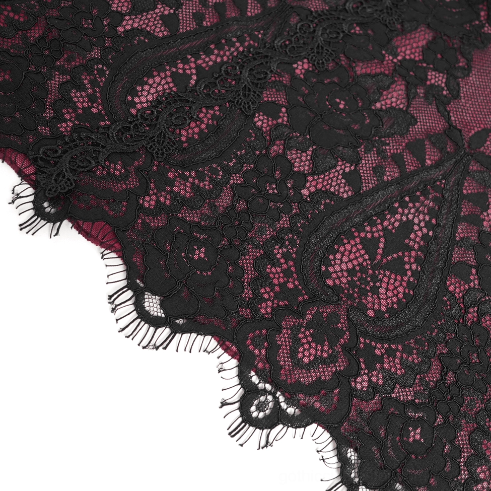 Three-quarter view of women's gothic lace mini dress displaying draped lace overlay and wine red base fabric layers