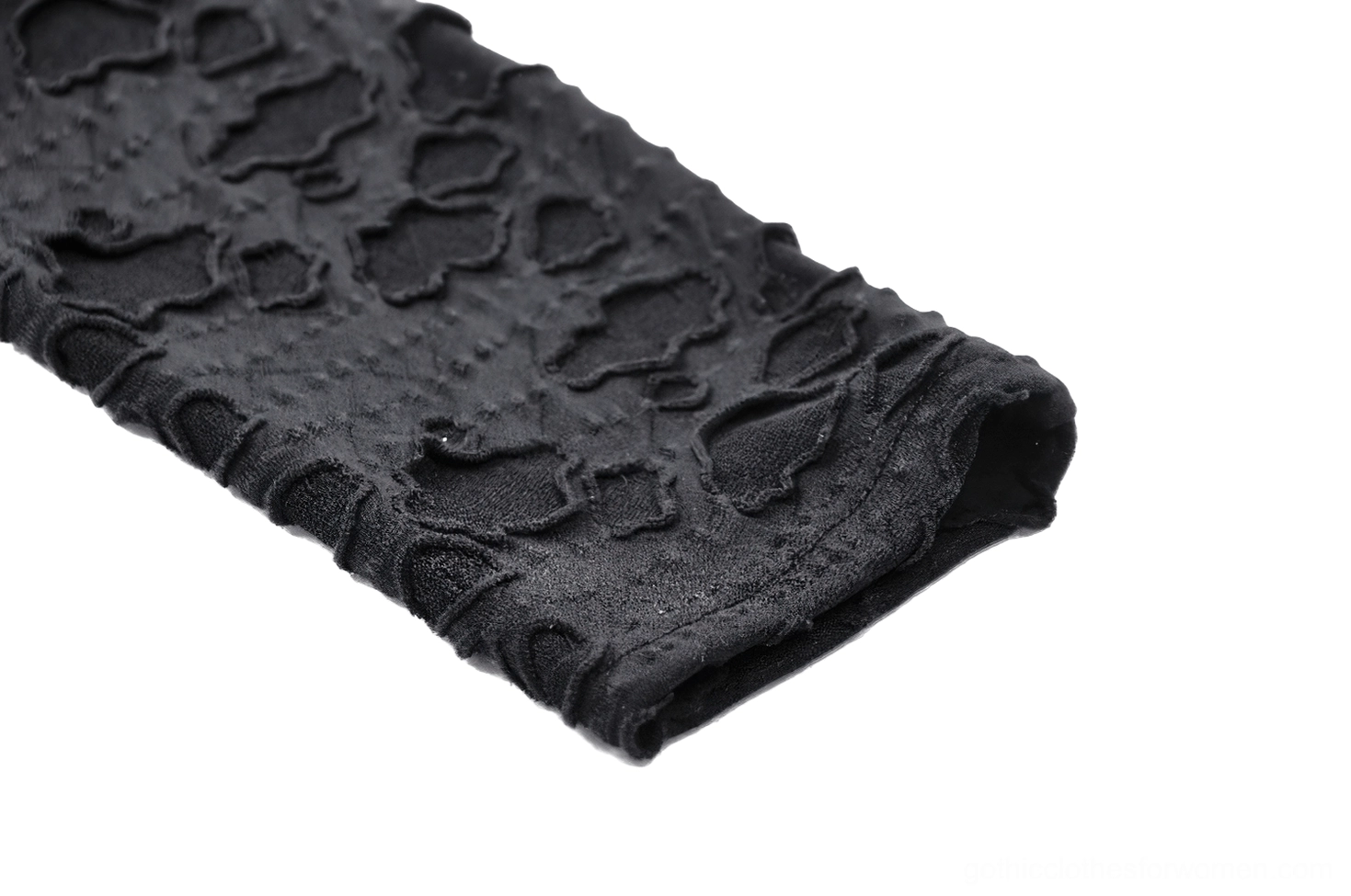 Black lace gothic hooded dress detail shot showcasing intricate all-over lace pattern and cat-ear hood construction