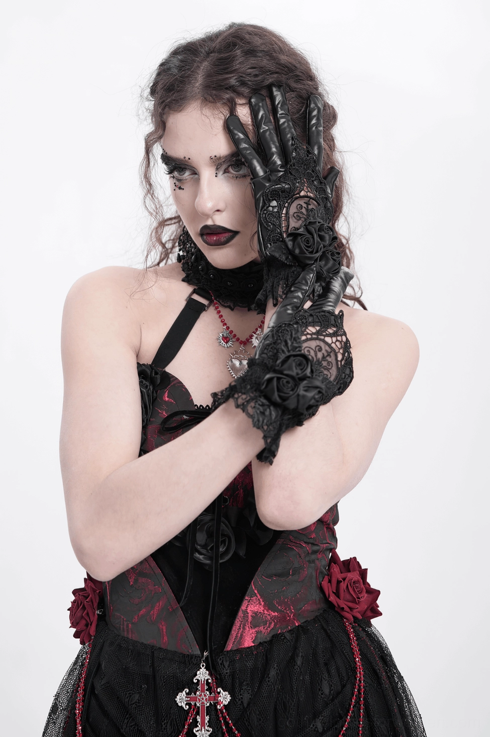 Gothic black lace rose gloves worn on hands showing fit and elegance