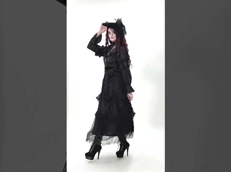Victorian gothic blouse styled with matching lace skirt and gothic hat, full-length red-haired model wearing complete dark romantic outfit