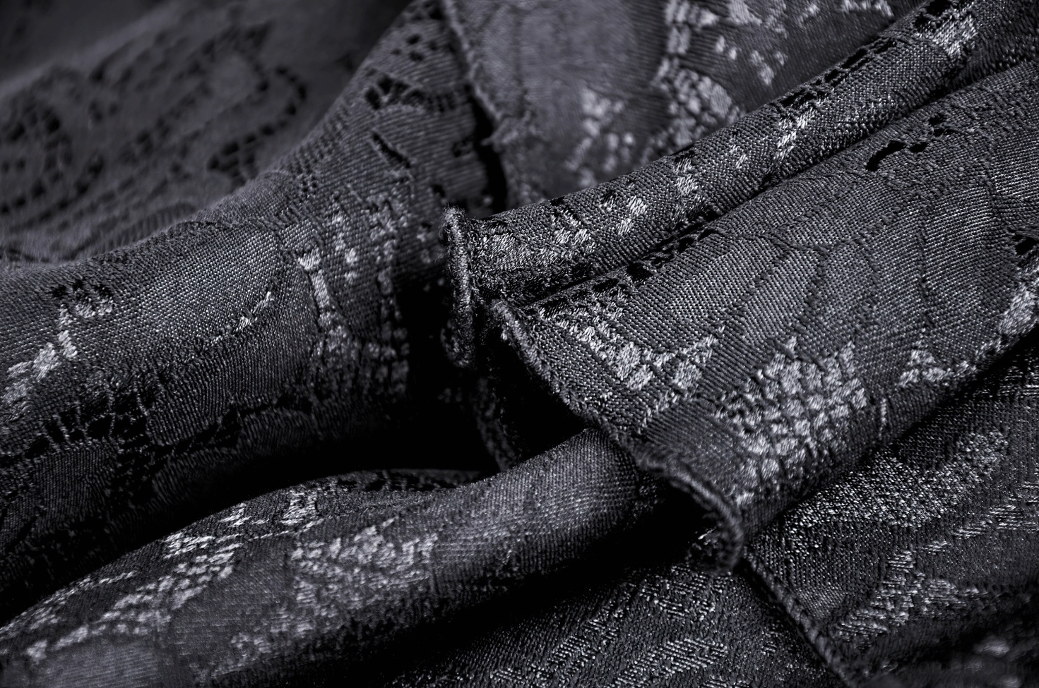 Black gothic lace maxi skirt cascading ruffles layered side view showing movement and drama