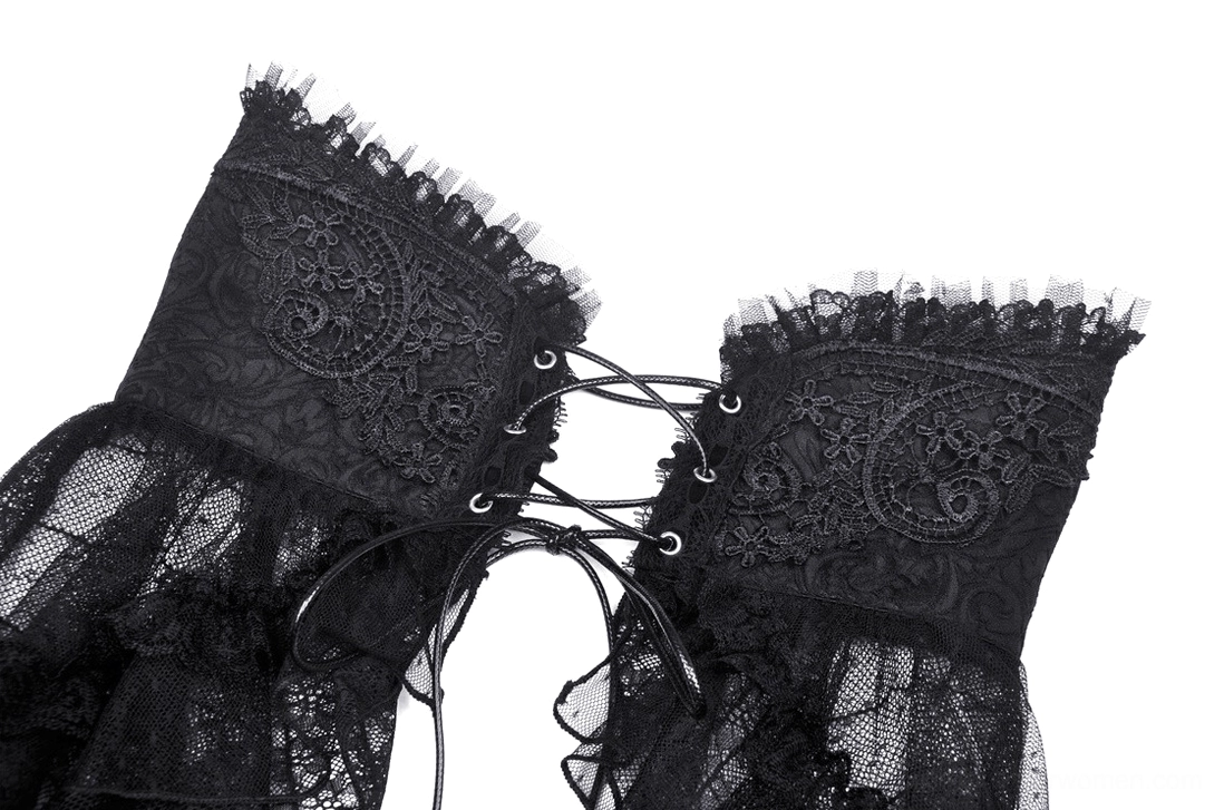 Close-up detail of embossed lace corset waist with lace-up ties and ruffled mesh trim