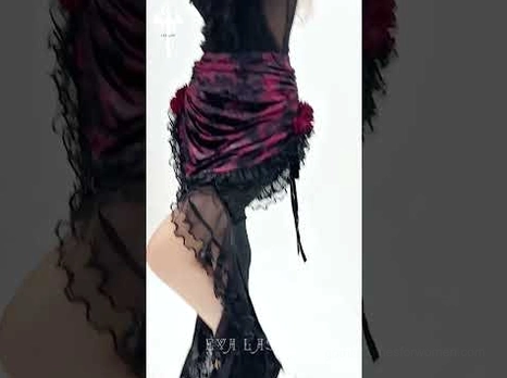Floor-length gothic lace skirt with synthetic leather corset waistband and floral lace overlay, mannequin back view