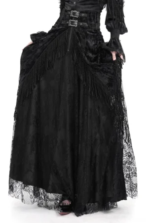Black lace Victorian gothic maxi skirt with corset waist and tassel details, front view on female model against white background