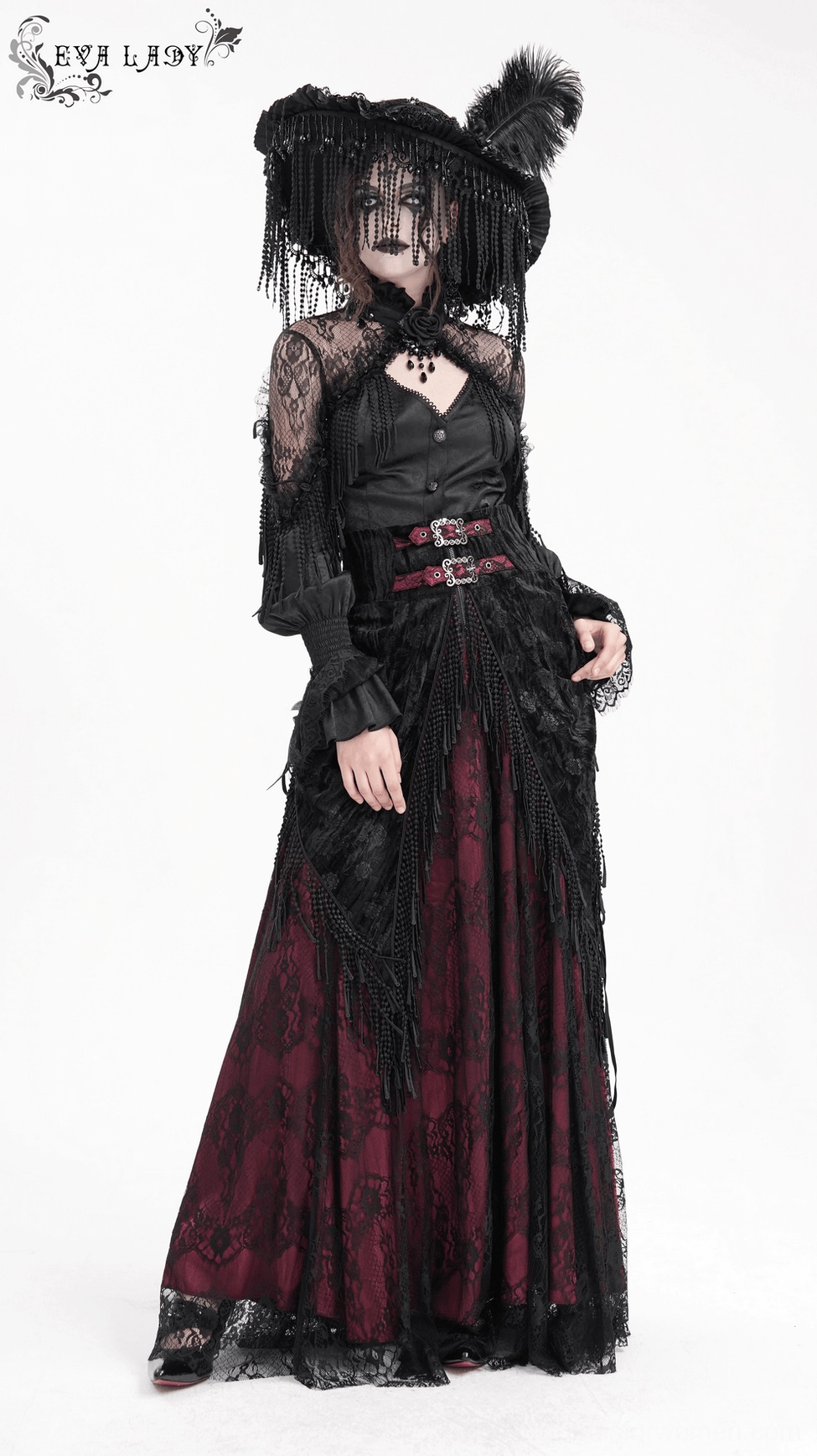 Gothic lace skirt detail shot showing ornate black floral lace pattern, wine red lining visibility, and sophisticated layering technique