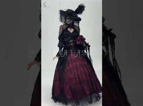 Female model wearing complete gothic formal ensemble with feathered hat, wine red lace skirt, and rose bouquet accessory in dark vintage backdrop