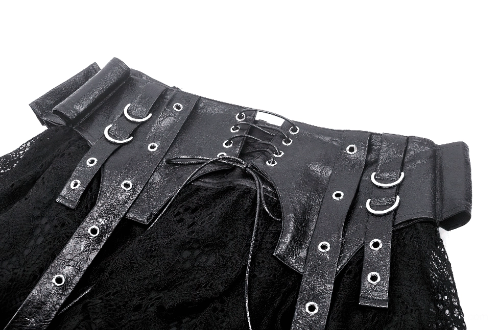Close-up detail of black faux leather corset front with metal grommets and lace-up design on gothic skirt