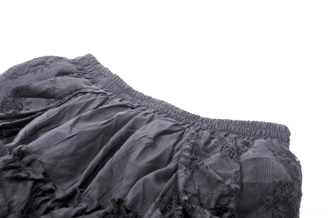 Detailed close-up of black gothic skirt waist with ruched elastic drawstring and lace trim edges