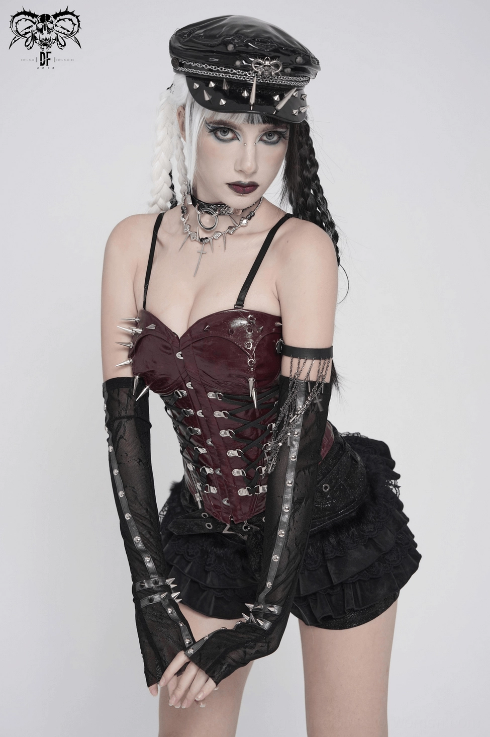 Product display of gothic lace arm sleeves with spike stud cuffs in flat lay showcasing alternative fashion accessory