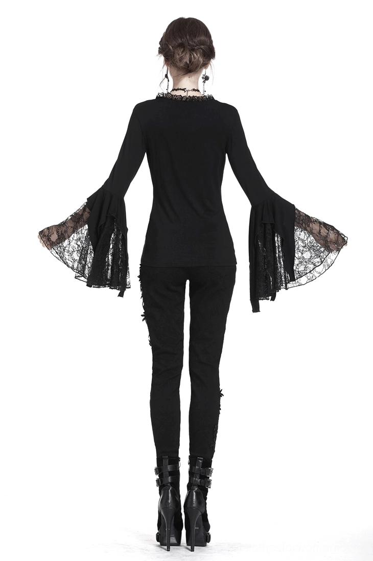 Full-length back view of model in black gothic lace bell sleeve top showing elegant silhouette