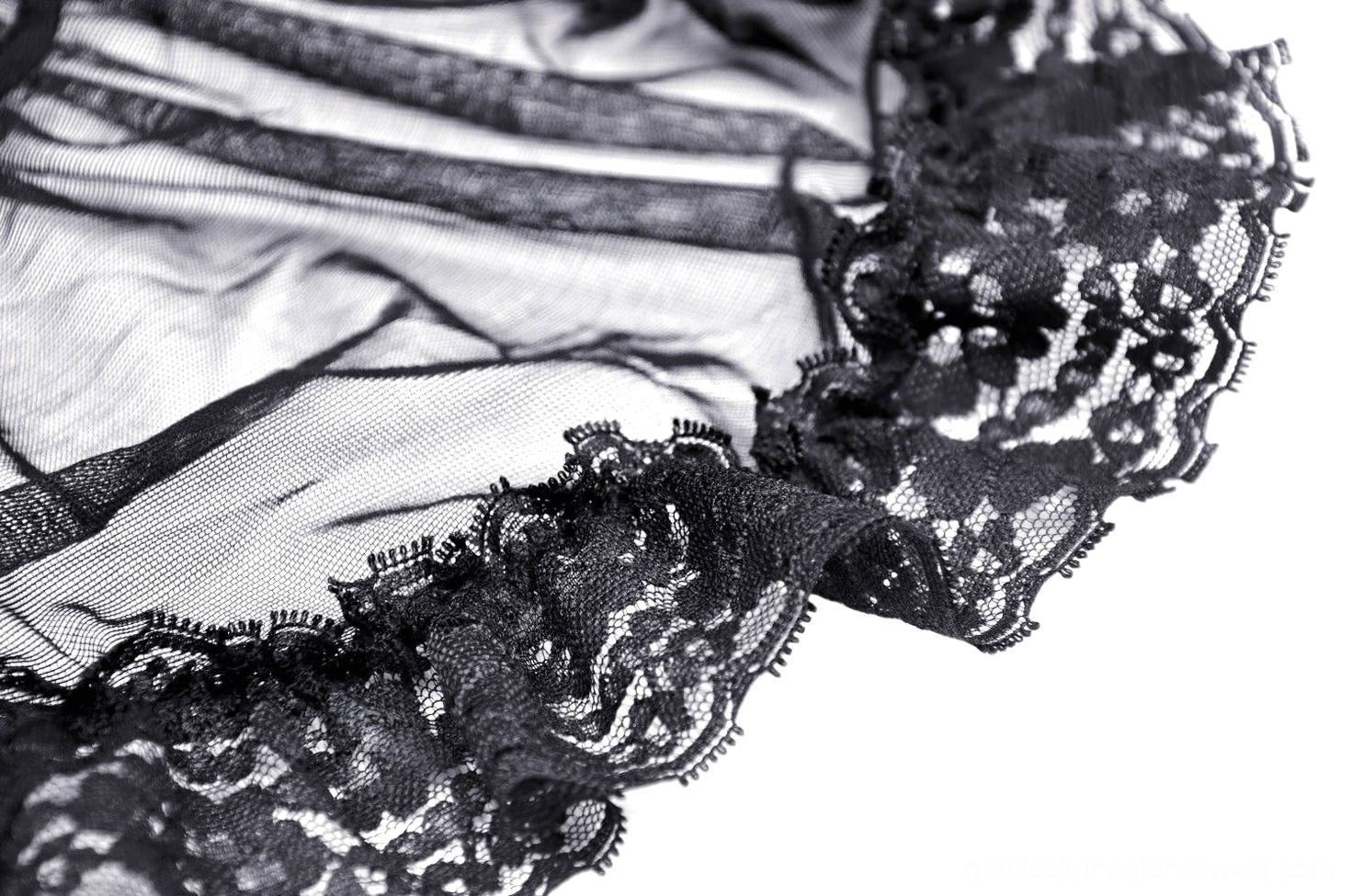 Black lace long sleeve gothic top paired with dark bottoms - alternative fashion look
